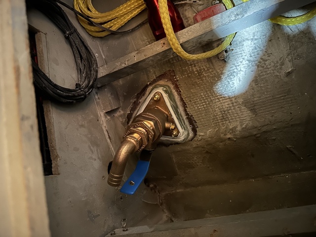 New Groco bronze water intake thruhull installed through the hull with blue-handled seacock